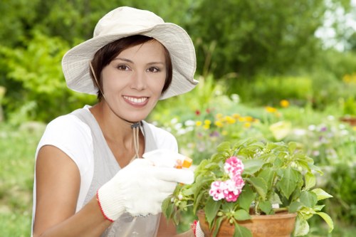 Staff wearing PPE while performing garden maintenance