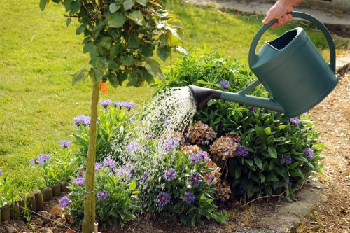 Contractor performing garden clearance in a Thamesmead yard